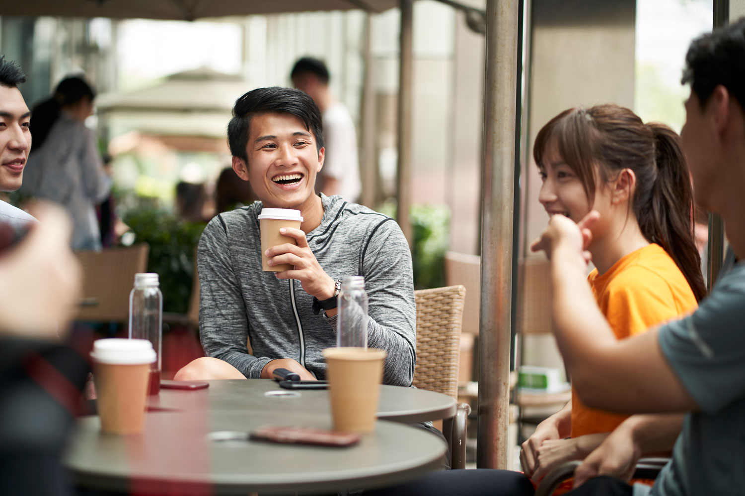 Friends enjoying coffee together at a café in Kepong